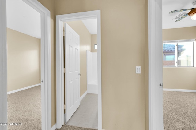 hallway with light colored carpet