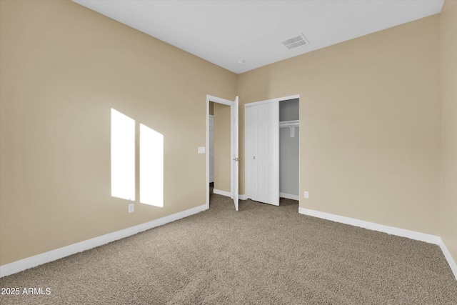 unfurnished bedroom featuring a closet and carpet