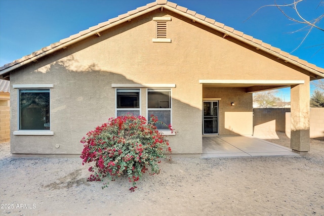 rear view of property with a patio