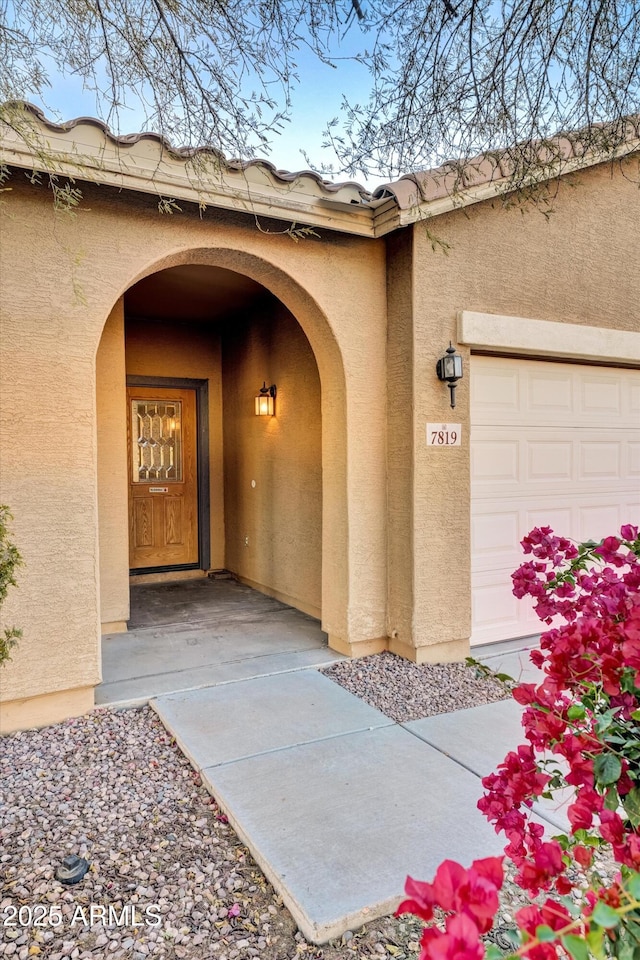 property entrance with a garage