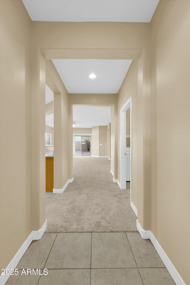 corridor with light carpet