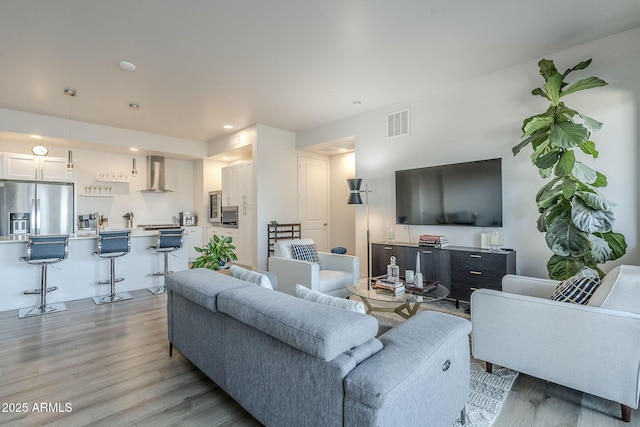 living room with light hardwood / wood-style floors