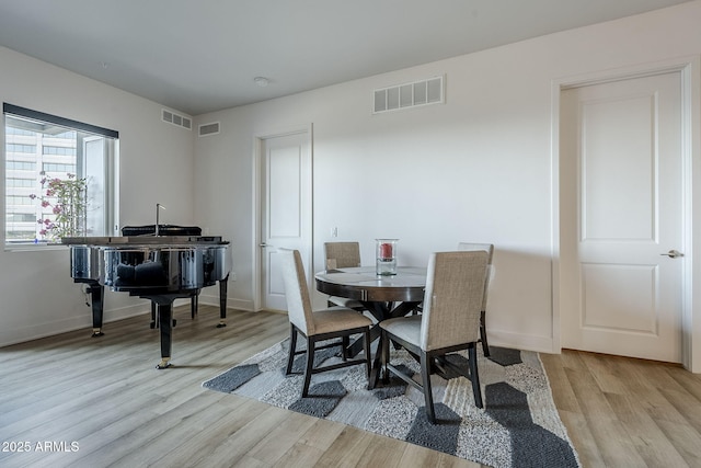 dining area with light wood-type flooring