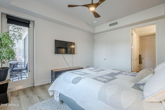 bedroom with ceiling fan, access to outside, and light hardwood / wood-style floors