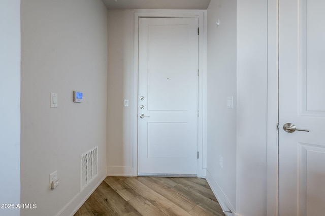 doorway to outside featuring light hardwood / wood-style flooring