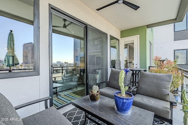 balcony featuring ceiling fan