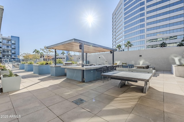 view of patio featuring an outdoor bar