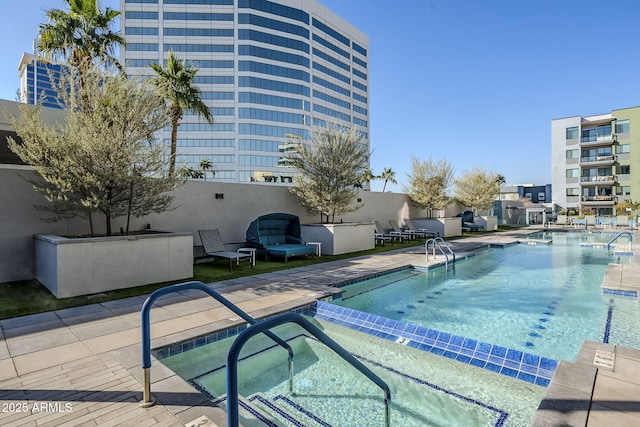 view of pool featuring a patio area