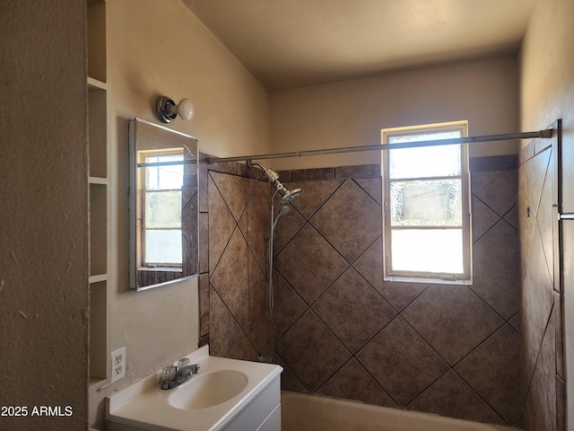 bathroom with shower / washtub combination and vanity