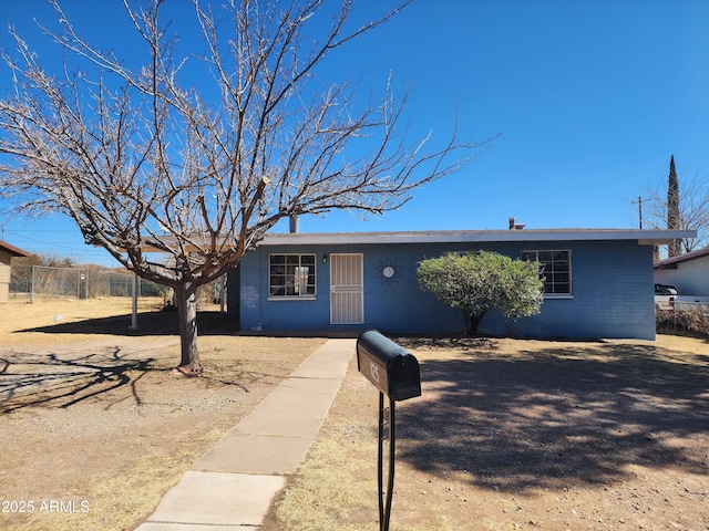 view of front of house featuring fence