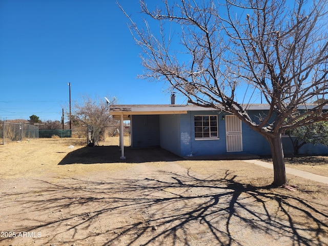 view of outdoor structure with an attached carport