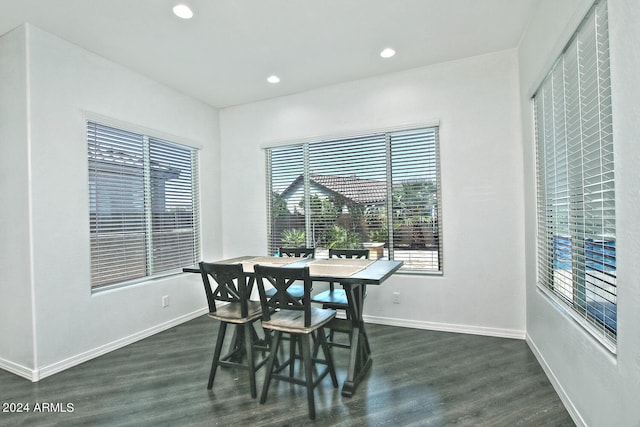 dining space with dark wood-type flooring