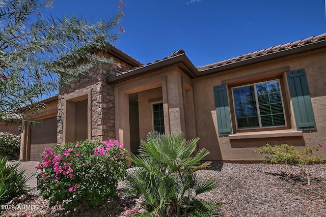 view of side of home with a garage