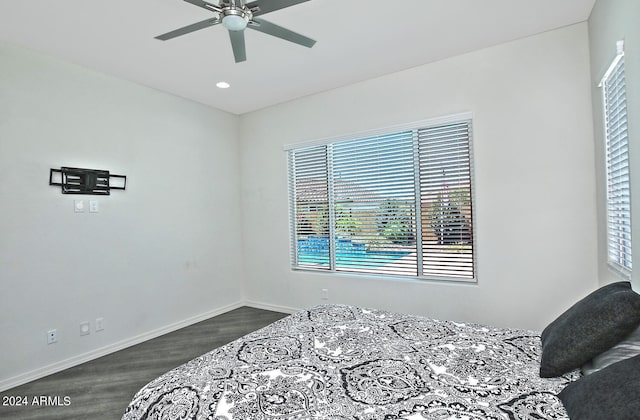 bedroom with ceiling fan and hardwood / wood-style floors