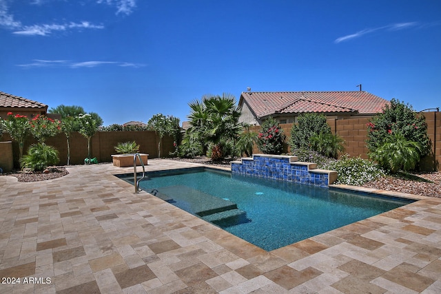 view of swimming pool featuring a patio and pool water feature