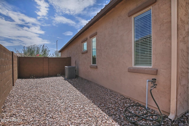 view of home's exterior with central AC