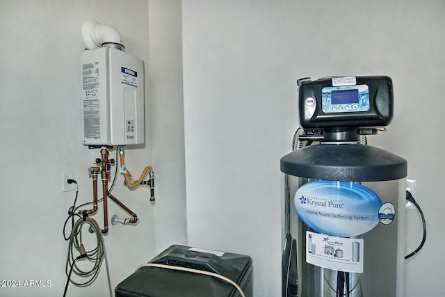 utility room featuring water heater