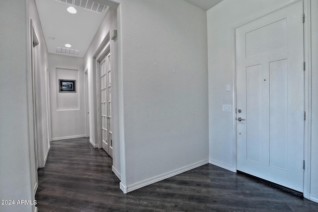 foyer entrance featuring dark hardwood / wood-style flooring