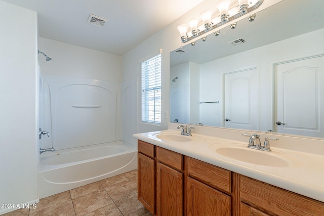 bathroom featuring tile patterned floors, vanity, and shower / tub combination