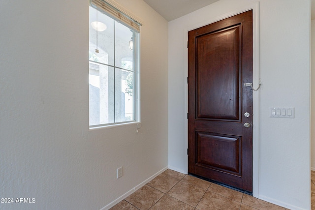 entryway featuring light tile patterned flooring