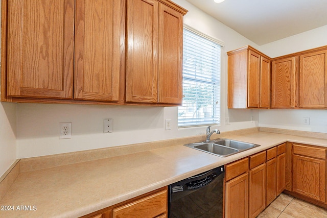 kitchen featuring dishwasher, light tile patterned flooring, and sink