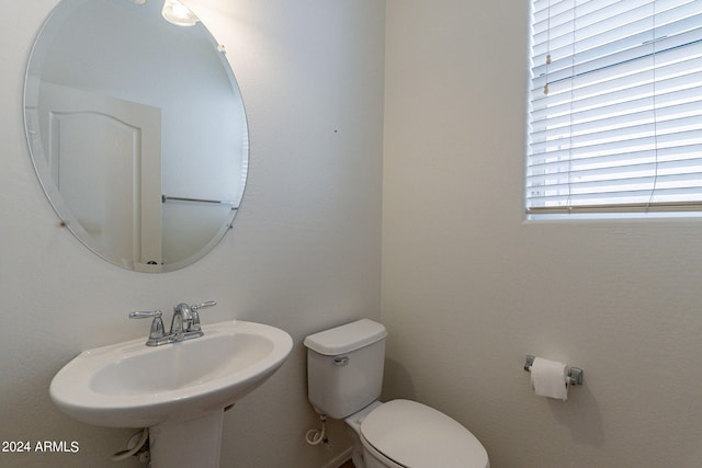 bathroom with toilet and sink