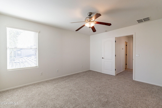 carpeted empty room with ceiling fan