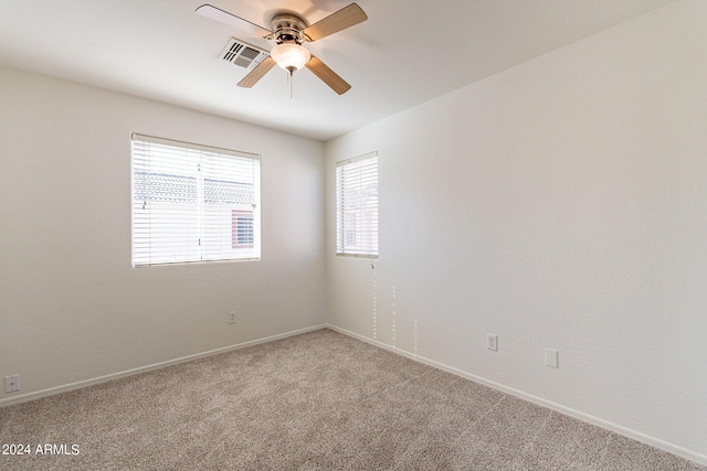 empty room with carpet and ceiling fan