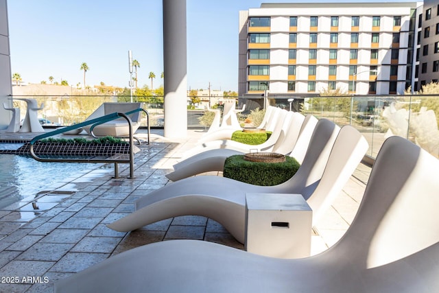 view of patio featuring a balcony