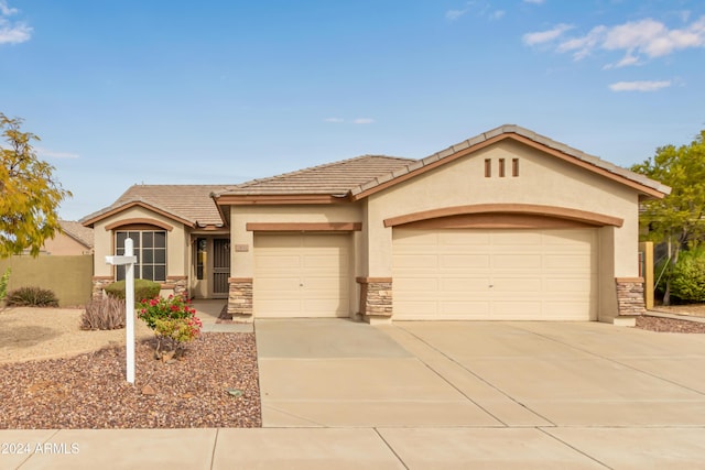 view of front of home with a garage