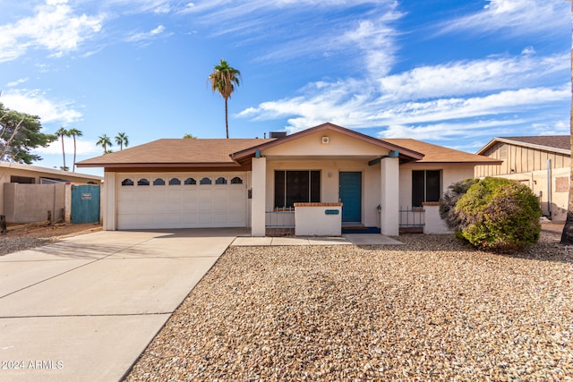 ranch-style home featuring a garage