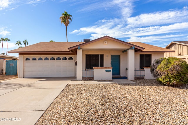 single story home featuring a garage