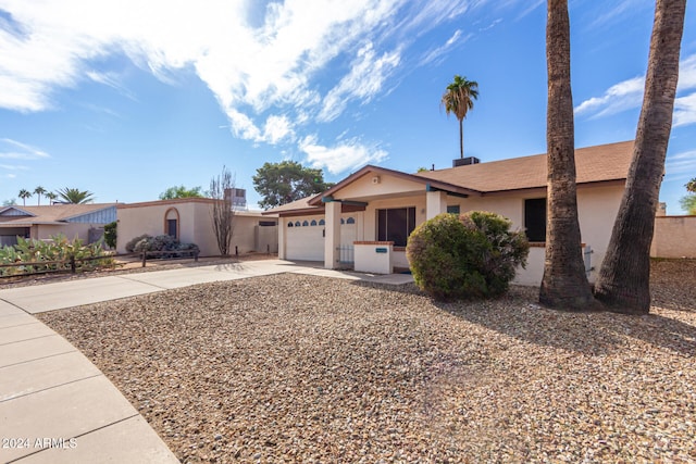 ranch-style home with a garage