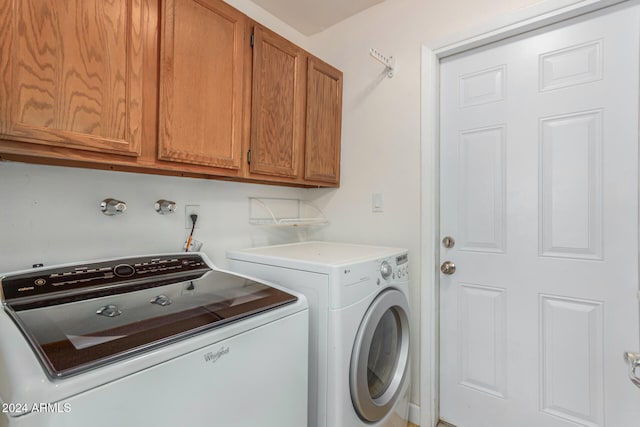 laundry area featuring cabinets and independent washer and dryer