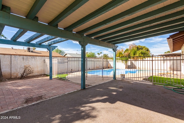 view of patio featuring a fenced in pool