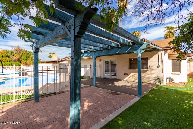 view of patio featuring a fenced in pool and a pergola