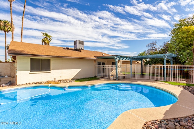 view of pool featuring central AC unit and a pergola