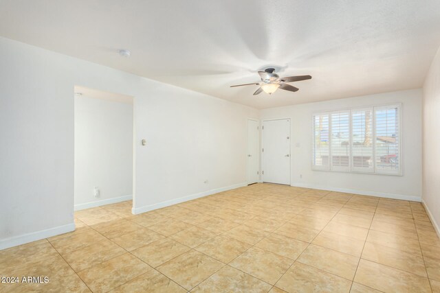 spare room with ceiling fan