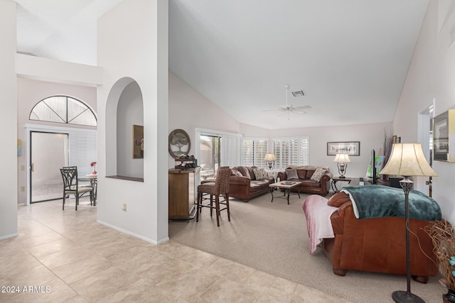 tiled living room featuring high vaulted ceiling and ceiling fan