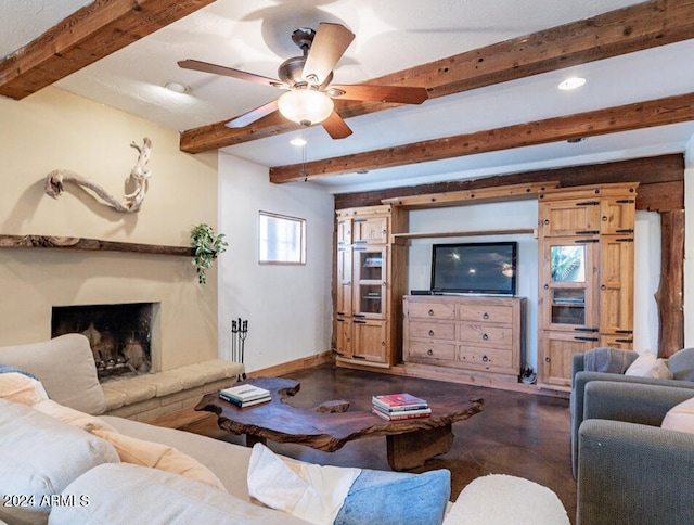 living room with ceiling fan and beamed ceiling