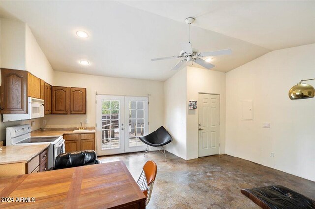 kitchen featuring vaulted ceiling, white appliances, ceiling fan, french doors, and sink