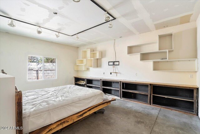 bedroom with concrete floors