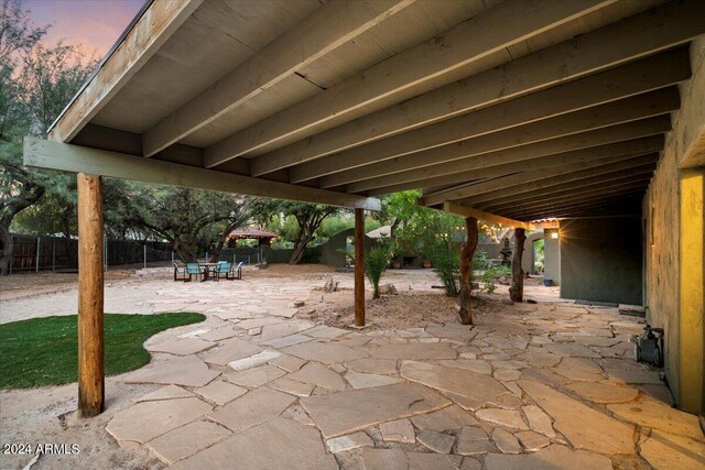 view of patio terrace at dusk