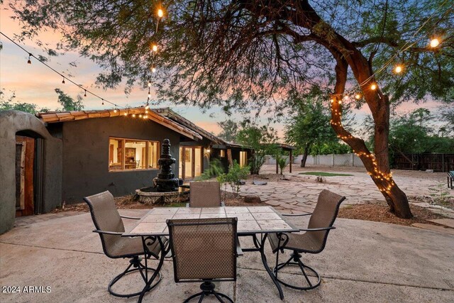 view of patio terrace at dusk