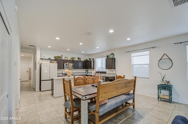 dining space with recessed lighting, visible vents, and light tile patterned flooring