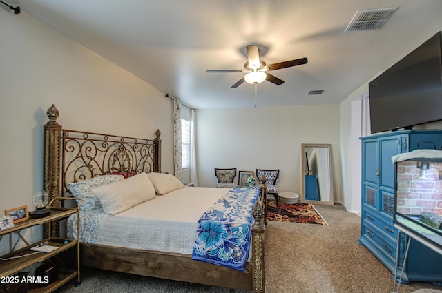 bedroom with carpet flooring, visible vents, and a ceiling fan