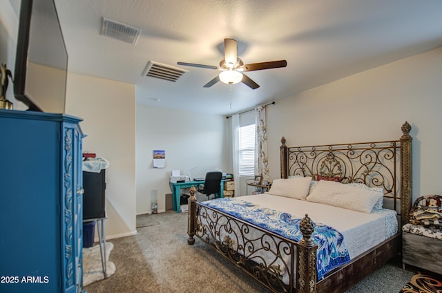 carpeted bedroom with visible vents and a ceiling fan