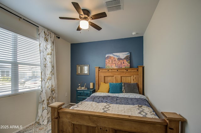 bedroom with ceiling fan and visible vents