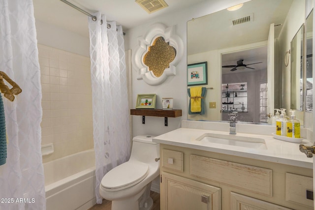 full bathroom featuring shower / bath combo, vanity, toilet, and ceiling fan