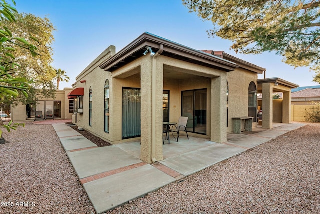 back of house featuring a patio